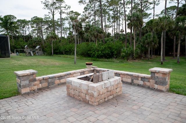 4407 Preservation Cir, Melbourne, FL 32934 - view of patio / terrace with an outdoor fire pit and view of scattered trees