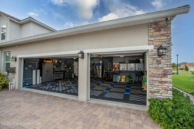 4407 Preservation Cir, Melbourne, FL 32934 - garage featuring decorative driveway