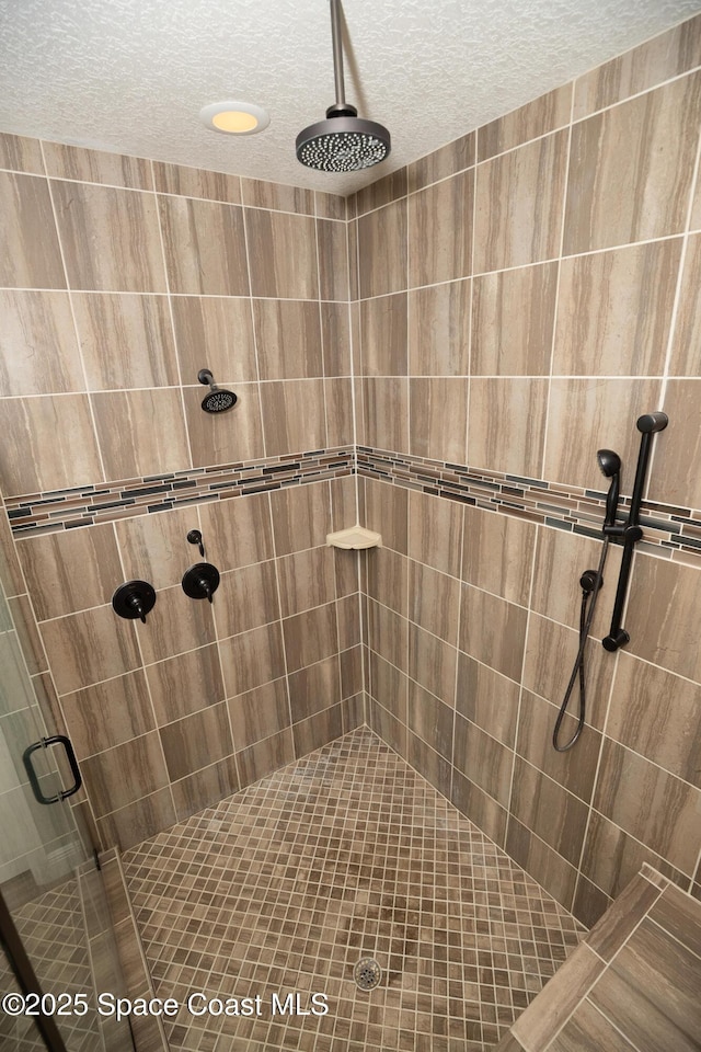 4407 Preservation Cir, Melbourne, FL 32934 - full bathroom with a shower stall and a textured ceiling