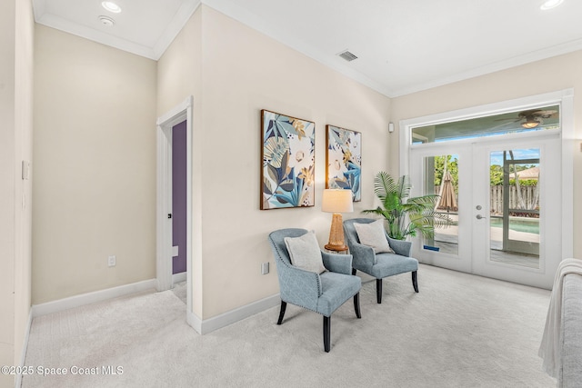 430 Monaco Dr, Indialantic, FL 32903 - living area with carpet flooring, ornamental molding, baseboards, and french doors