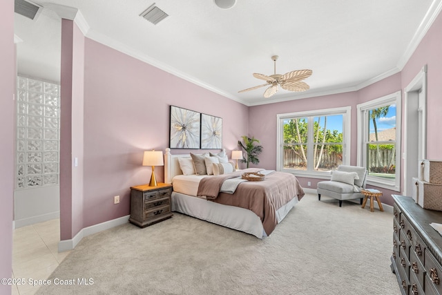 430 Monaco Dr, Indialantic, FL 32903 - bedroom featuring ornamental molding, baseboards, light colored carpet, ceiling fan, and access to exterior