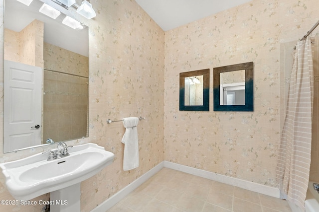 430 Monaco Dr, Indialantic, FL 32903 - bathroom with baseboards, wallpapered walls, a sink, curtained shower, and tile patterned flooring