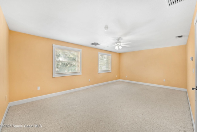 430 Monaco Dr, Indialantic, FL 32903 - spare room featuring ceiling fan, baseboards, and carpet floors