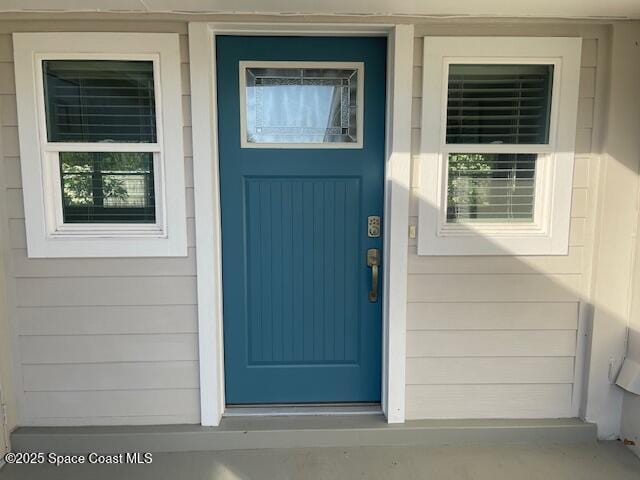 doorway to property featuring a porch