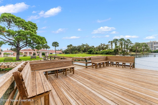 343 N Tropical Trl Unit 404, Merritt Island, FL 32953 - wooden deck with a lawn