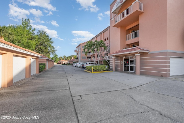 343 N Tropical Trl Unit 404, Merritt Island, FL 32953 - view of street featuring community garages
