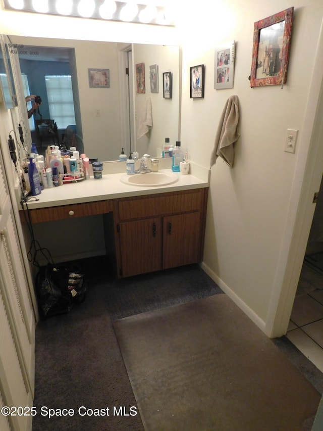 854 Custer St NW, Palm Bay, FL 32907 - bathroom with vanity and baseboards