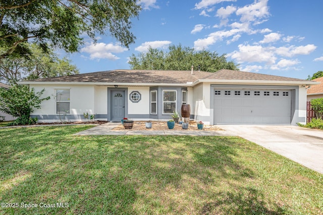 2040 Lansing St, Melbourne, FL 32935 - ranch-style house featuring stucco siding, an attached garage, driveway, and a front lawn