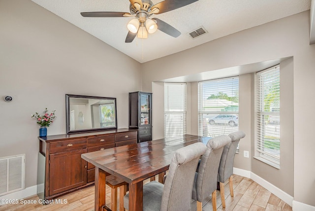 2040 Lansing St, Melbourne, FL 32935 - dining area featuring light wood-style floors, baseboards, vaulted ceiling, and a ceiling fan