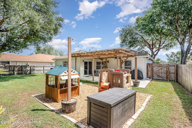 2040 Lansing St, Melbourne, FL 32935 - rear view of house featuring stucco siding, a ceiling fan, a gate, and a patio area