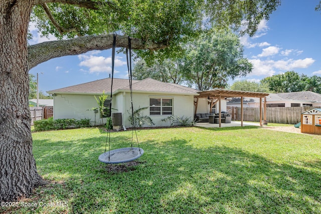 2040 Lansing St, Melbourne, FL 32935 - rear view of property featuring a pergola, stucco siding, a patio area, roof with shingles, and central AC