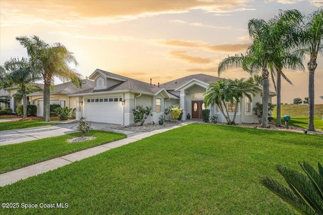 2268 Brightwood Cir, Rockledge, FL 32955 - view of front of house with an attached garage, stucco siding, concrete driveway, and a front yard