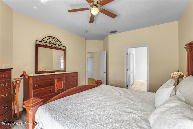 2268 Brightwood Cir, Rockledge, FL 32955 - bedroom with a ceiling fan and a textured ceiling