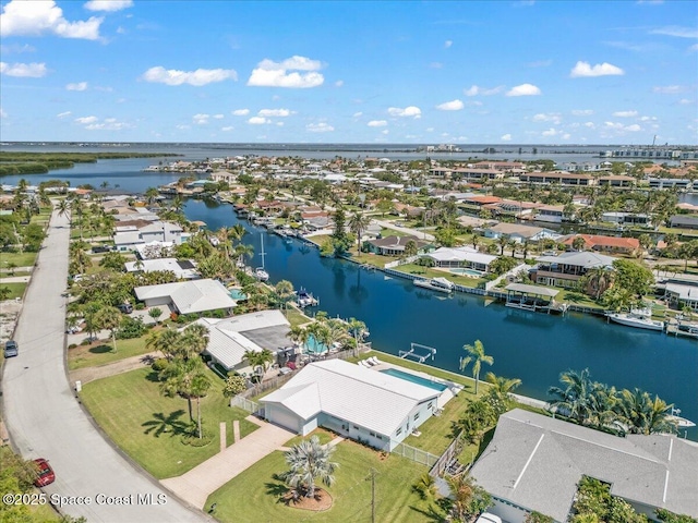 aerial perspective of suburban area with a large body of water