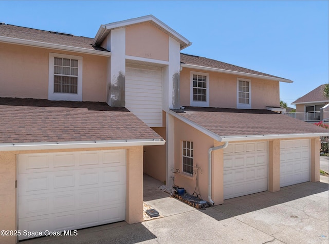 165 Escambia Ln Unit 502, Cocoa Beach, FL 32931 - view of property featuring roof with shingles and stucco siding