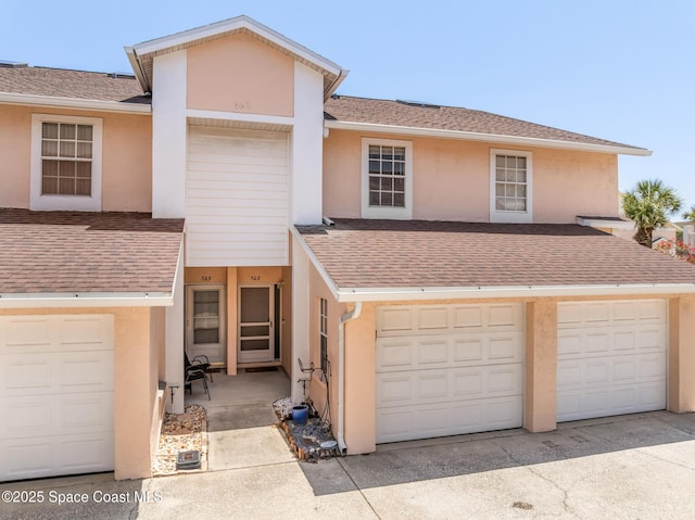 165 Escambia Ln Unit 502, Cocoa Beach, FL 32931 - townhome / multi-family property featuring stucco siding and a shingled roof