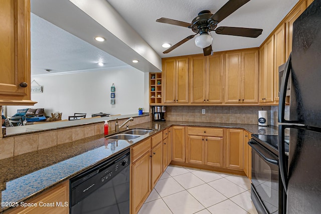 165 Escambia Ln Unit 502, Cocoa Beach, FL 32931 - kitchen featuring a sink, black appliances, dark stone counters, a ceiling fan, and backsplash