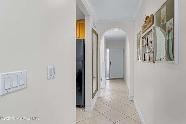 165 Escambia Ln Unit 502, Cocoa Beach, FL 32931 - hall with light tile patterned floors, arched walkways, ornamental molding, and baseboards