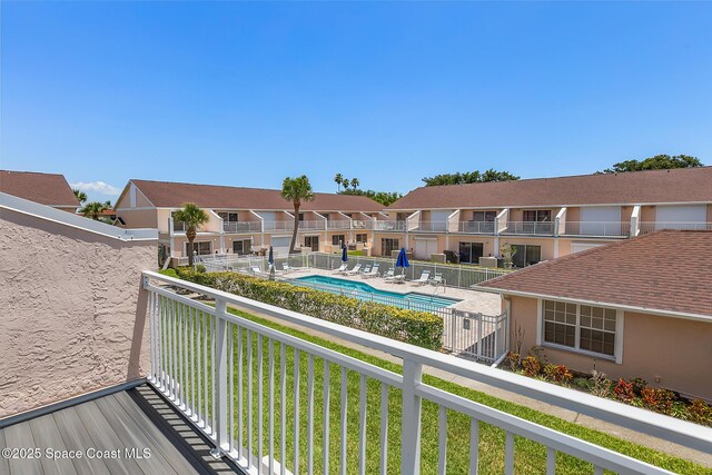 165 Escambia Ln Unit 502, Cocoa Beach, FL 32931 - balcony with view of pool area and a residential view