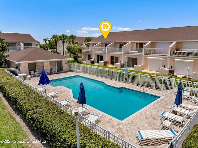 165 Escambia Ln Unit 502, Cocoa Beach, FL 32931 - community pool featuring fence and a patio