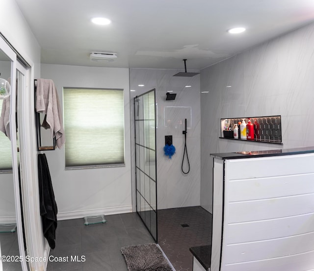 886 Spirea Dr, Rockledge, FL 32955 - full bath featuring a walk in shower, tile patterned flooring, recessed lighting, and baseboards