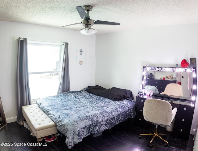886 Spirea Dr, Rockledge, FL 32955 - bedroom with wood finished floors, a textured ceiling, and a ceiling fan