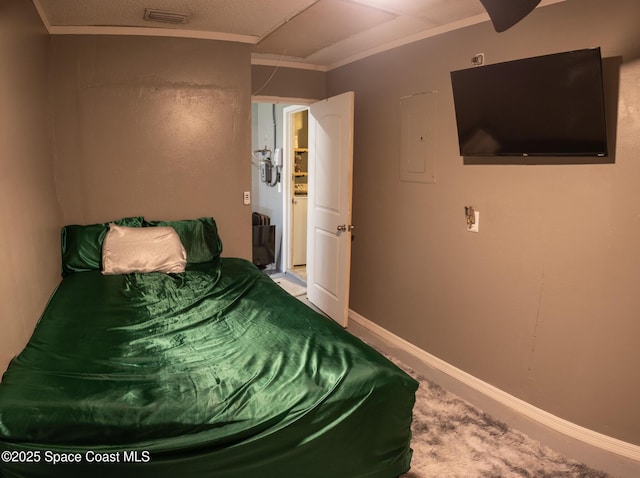 886 Spirea Dr, Rockledge, FL 32955 - carpeted bedroom with electric panel, baseboards, and ornamental molding
