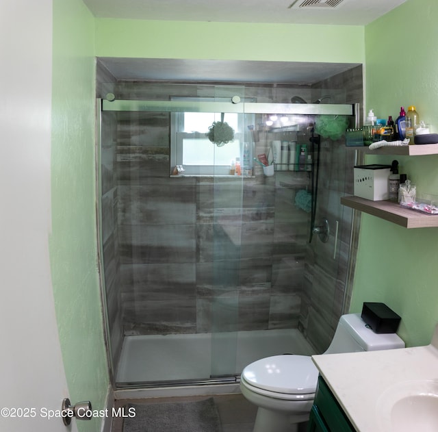 886 Spirea Dr, Rockledge, FL 32955 - bathroom with vanity, toilet, and a shower stall