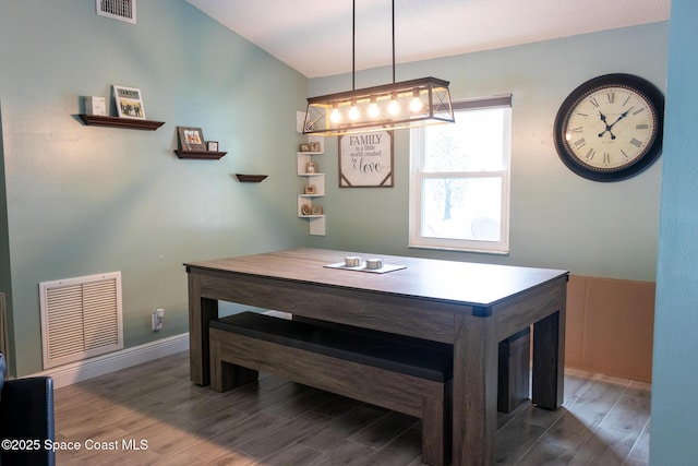 886 Spirea Dr, Rockledge, FL 32955 - dining space with wood finished floors and a chandelier