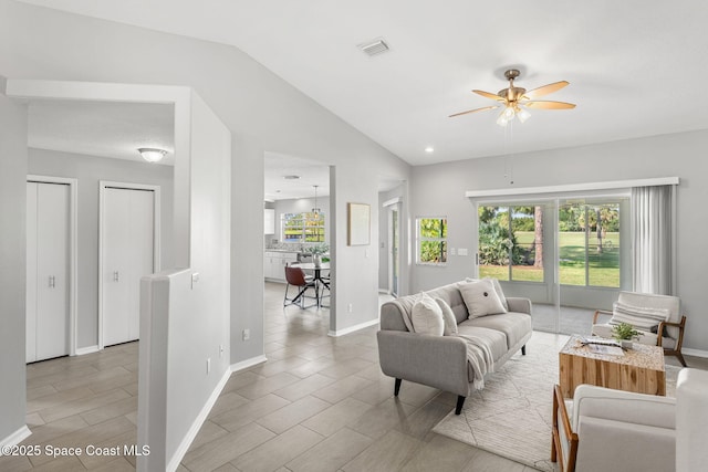 2102 Durban Ct, Rockledge, FL 32955 - living room featuring vaulted ceiling, a ceiling fan, plenty of natural light, and baseboards