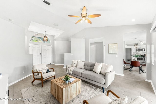 2102 Durban Ct, Rockledge, FL 32955 - living area with lofted ceiling, a ceiling fan, and baseboards