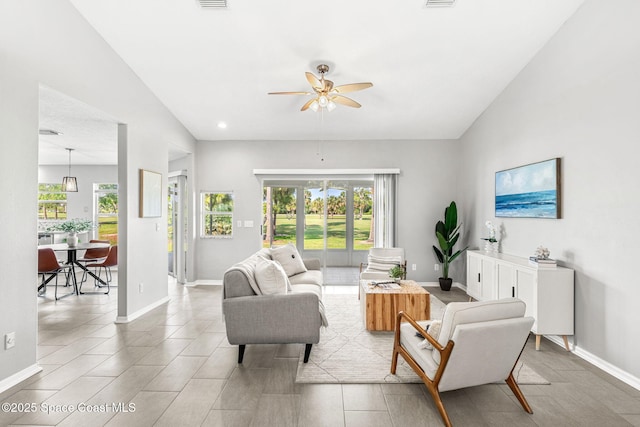 2102 Durban Ct, Rockledge, FL 32955 - living room featuring healthy amount of natural light, ceiling fan, and baseboards
