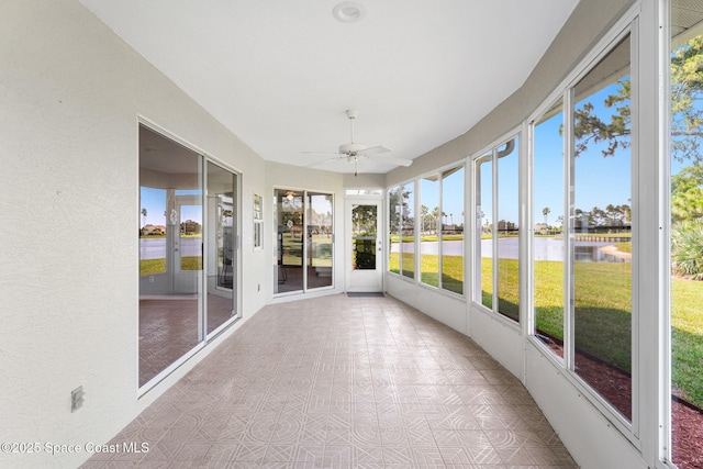 2102 Durban Ct, Rockledge, FL 32955 - unfurnished sunroom with a water view, a ceiling fan, and french doors