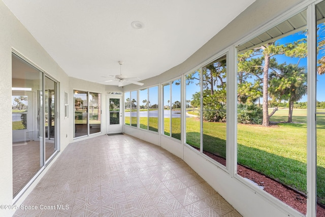 2102 Durban Ct, Rockledge, FL 32955 - unfurnished sunroom featuring healthy amount of natural light, ceiling fan, and a water view