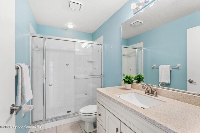 2102 Durban Ct, Rockledge, FL 32955 - bathroom featuring vanity, toilet, a shower stall, and tile patterned floors