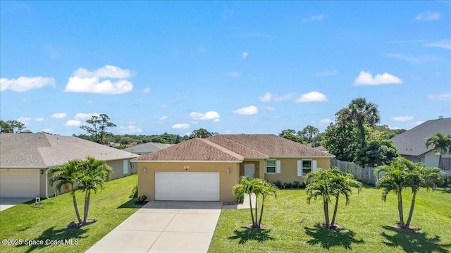 single story home with a garage, driveway, and stucco siding