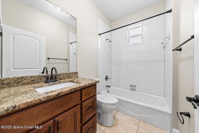 bathroom featuring toilet, tile patterned flooring, vanity, and bathtub / shower combination