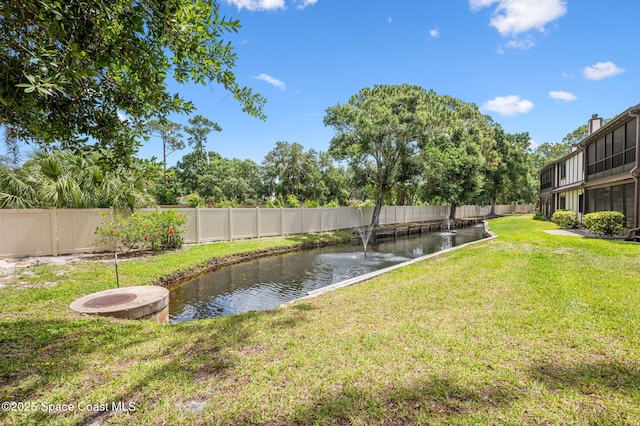 747 Greenwood Manor Cir Unit 17-A, West Melbourne, FL 32904 - view of yard with a small pond