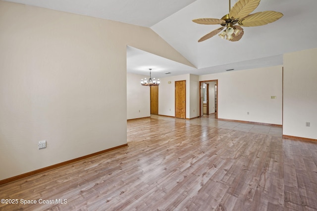 747 Greenwood Manor Cir Unit 17-A, West Melbourne, FL 32904 - spare room with a chandelier, ceiling fan, lofted ceiling, and light wood-style flooring