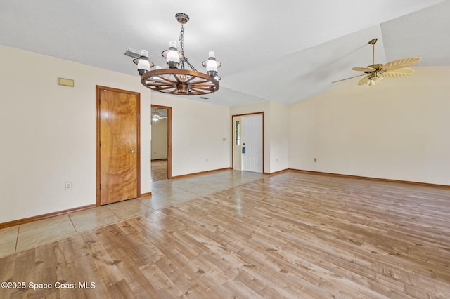 747 Greenwood Manor Cir Unit 17-A, West Melbourne, FL 32904 - empty room featuring a chandelier, wood finished floors, a ceiling fan, and lofted ceiling