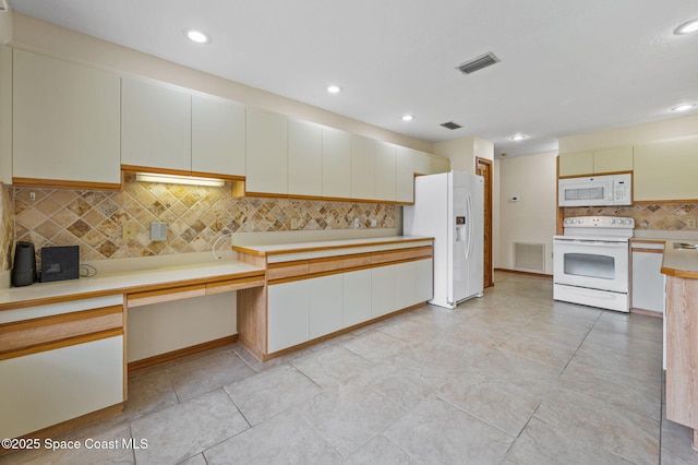 747 Greenwood Manor Cir Unit 17-A, West Melbourne, FL 32904 - kitchen with white appliances, decorative backsplash, light countertops, recessed lighting, and light tile patterned floors