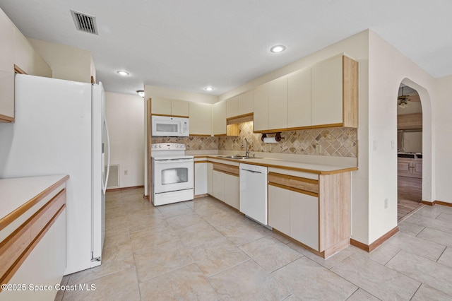 747 Greenwood Manor Cir Unit 17-A, West Melbourne, FL 32904 - kitchen featuring white appliances, light countertops, decorative backsplash, recessed lighting, and light tile patterned floors