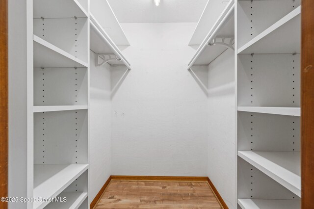 747 Greenwood Manor Cir Unit 17-A, West Melbourne, FL 32904 - spacious closet featuring wood finished floors