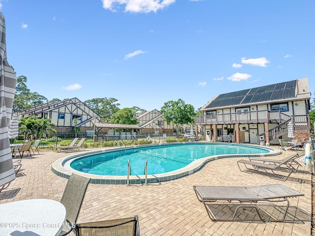 747 Greenwood Manor Cir Unit 17-A, West Melbourne, FL 32904 - community pool featuring a patio, stairway, and a residential view