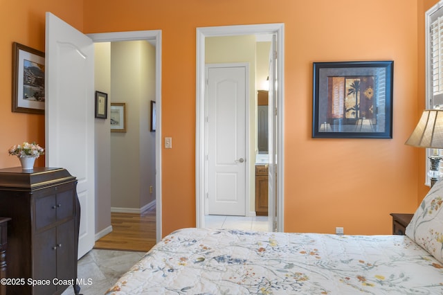 1035 Quail Ct SW, Vero Beach, FL 32968 - bedroom featuring baseboards and light tile patterned floors