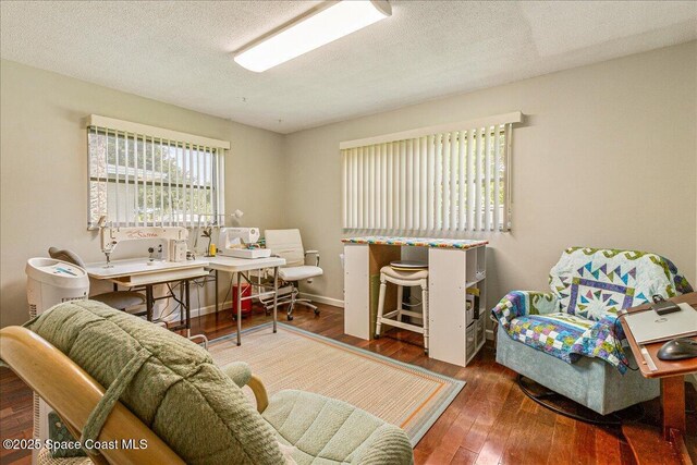 306 Glen Ridge Rd, Cocoa, FL 32926 - living room featuring wood-type flooring, an office area, and a textured ceiling