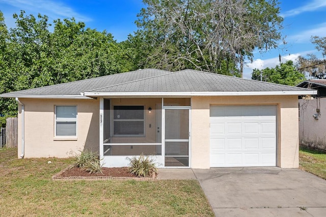 517 Fulton St, Daytona Beach, FL 32114 - single story home featuring stucco siding, concrete driveway, a front yard, and an attached garage