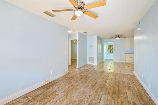 517 Fulton St, Daytona Beach, FL 32114 - unfurnished room featuring ceiling fan, light wood-style flooring, and baseboards