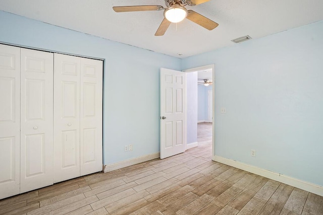 517 Fulton St, Daytona Beach, FL 32114 - unfurnished bedroom featuring light wood-type flooring, baseboards, and a closet