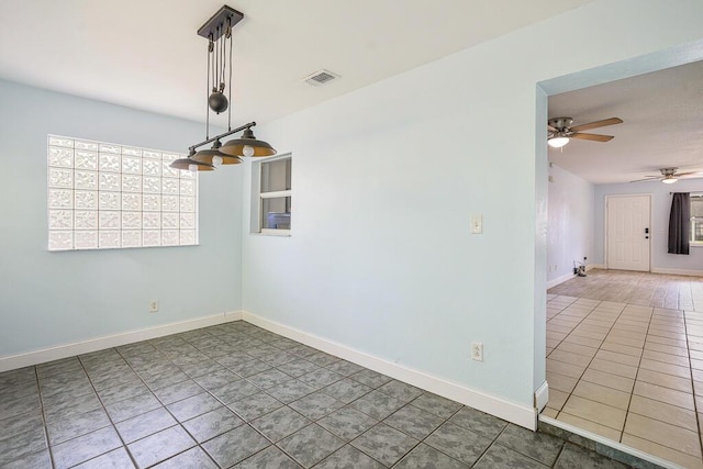 517 Fulton St, Daytona Beach, FL 32114 - tiled empty room featuring ceiling fan and baseboards